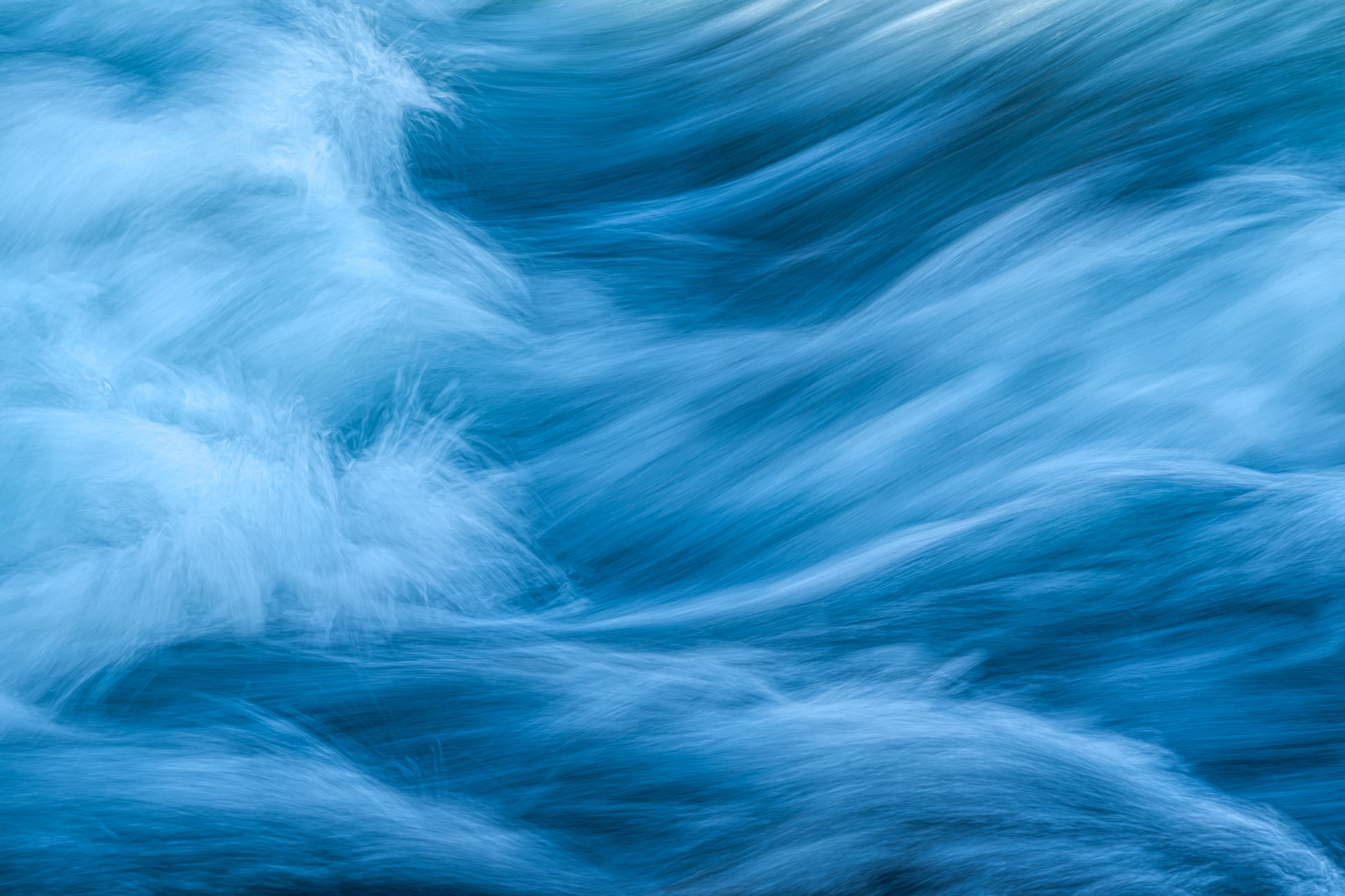 Serene fine art photograph of blue waterfall in Iceland with soft tones for living room decor