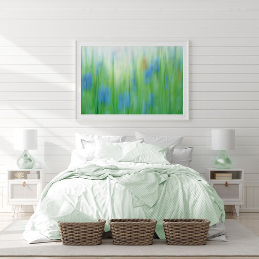 Framed print in white bedroom of Blue cornflowera in abstract that reminds you of a Monet garden