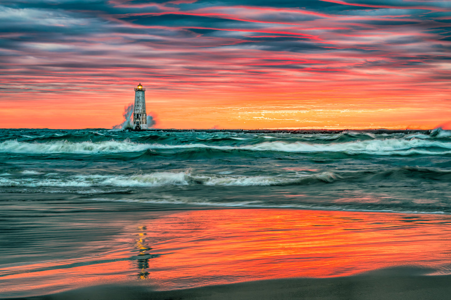 Vibrant sunset at Frankfort Lighthouse with deep teal water and orange sky fine art print.