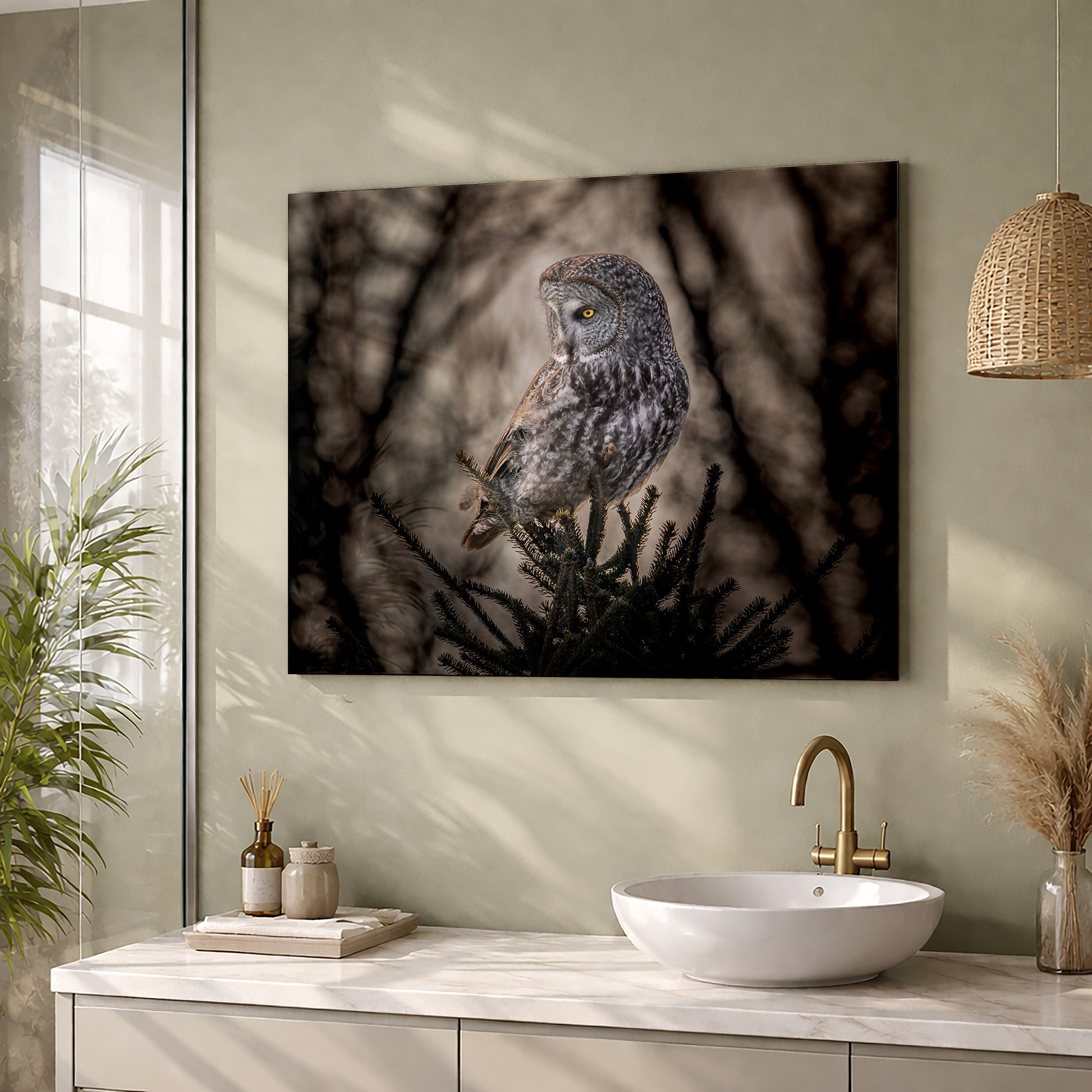 Bathroom with a Great Gray Owl metal print on the wall above a sink.