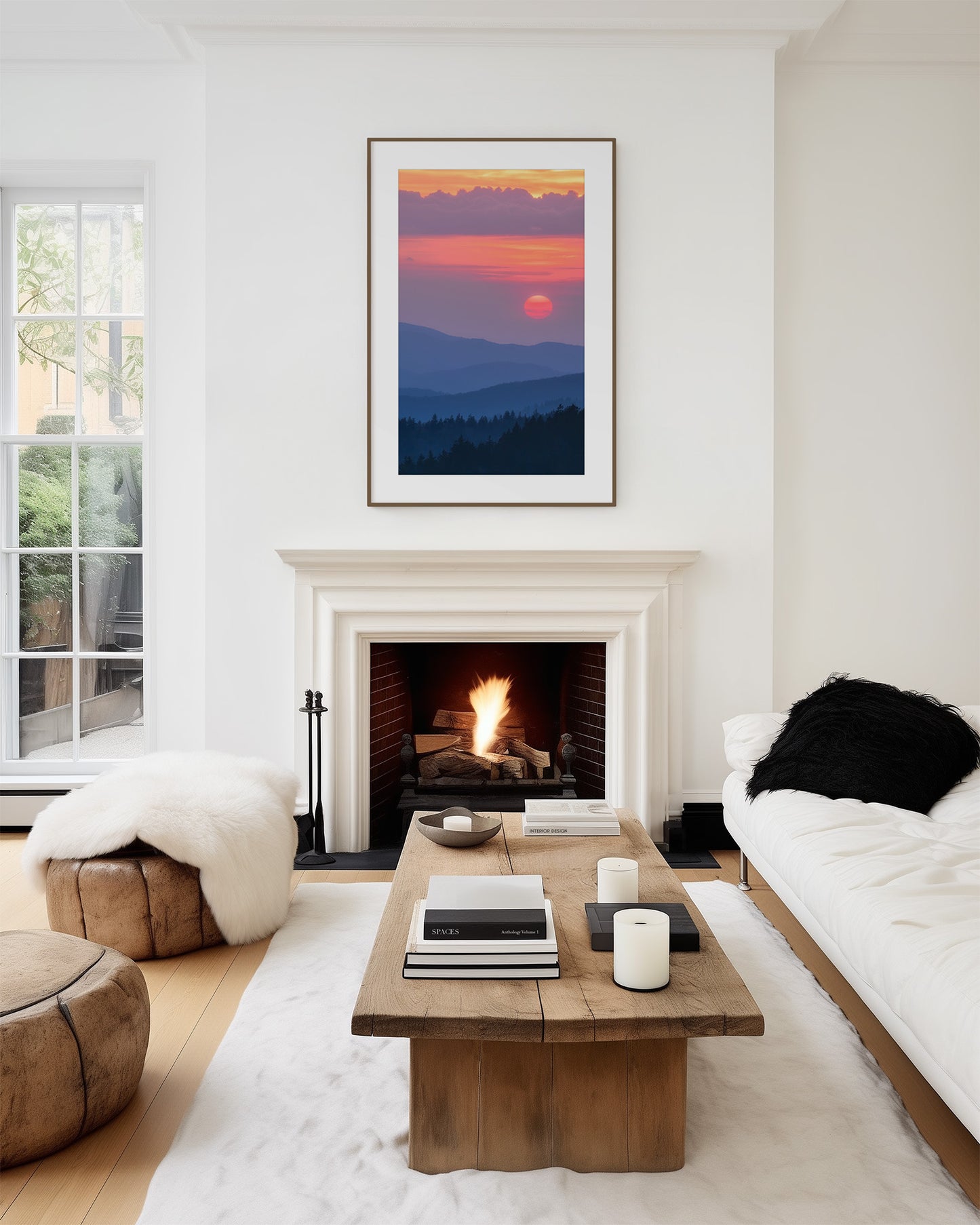Modern living room with a fireplace, wooden coffee table, and Smoky Mountain sunset artwork on the wall.