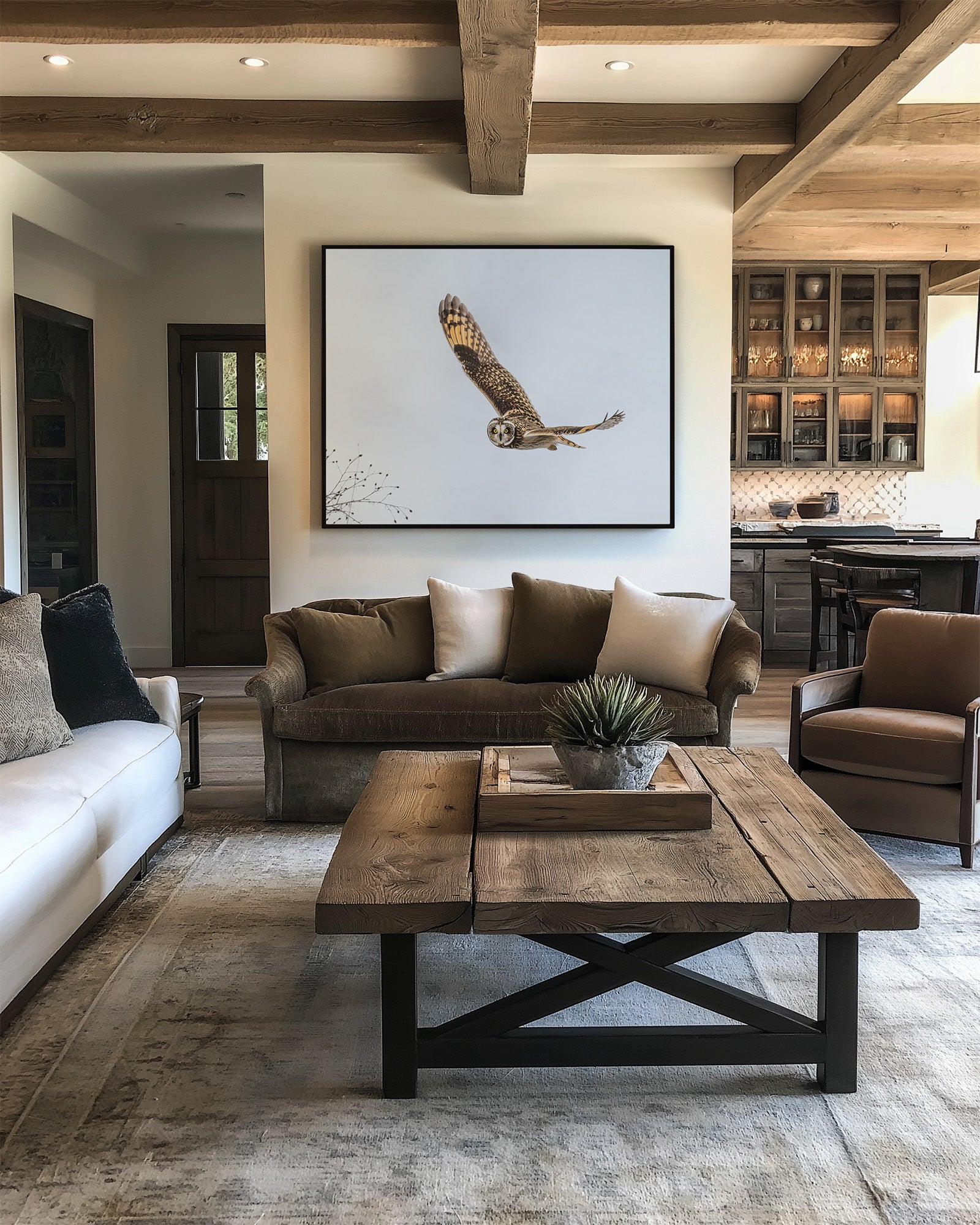 Short-eared owl in flight  fine art print in modern living room with brown sofa, beige rug, and wooden coffee table.